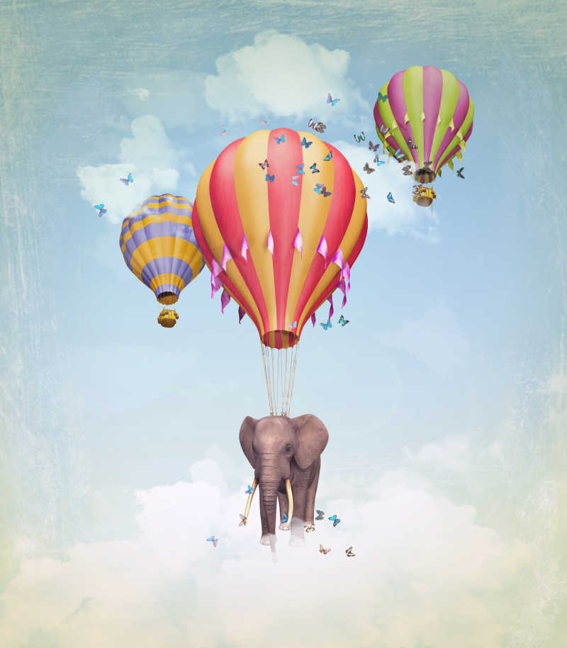 飞行在天空中的大象与气球