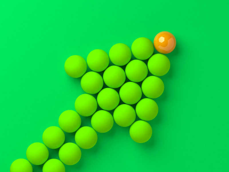 3D绿色球组成的箭头和绿色背景