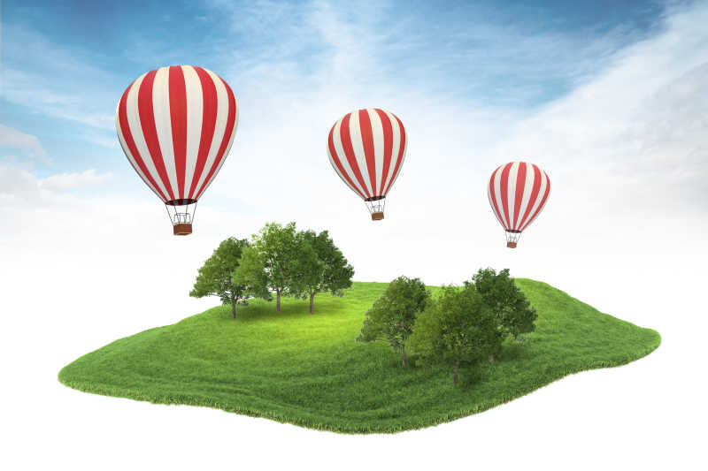 绿色草地树木与漂浮的热气球
