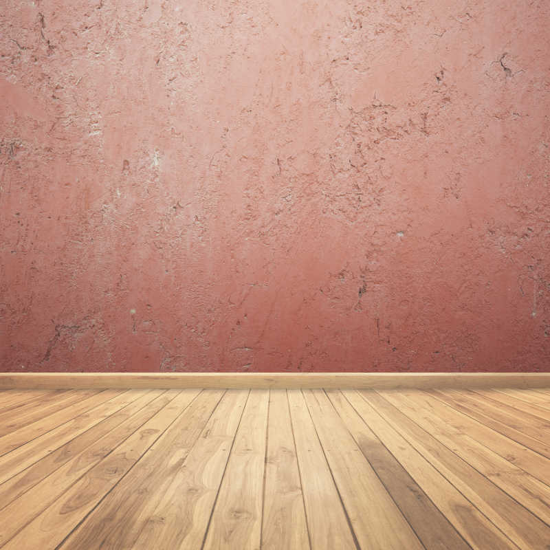 红色的水泥墙和木制地板