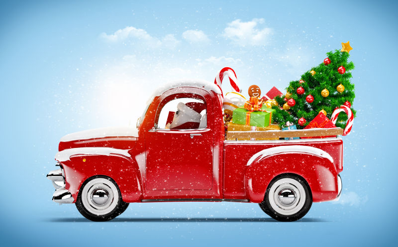 开着红色卡车载满礼物的圣诞老人