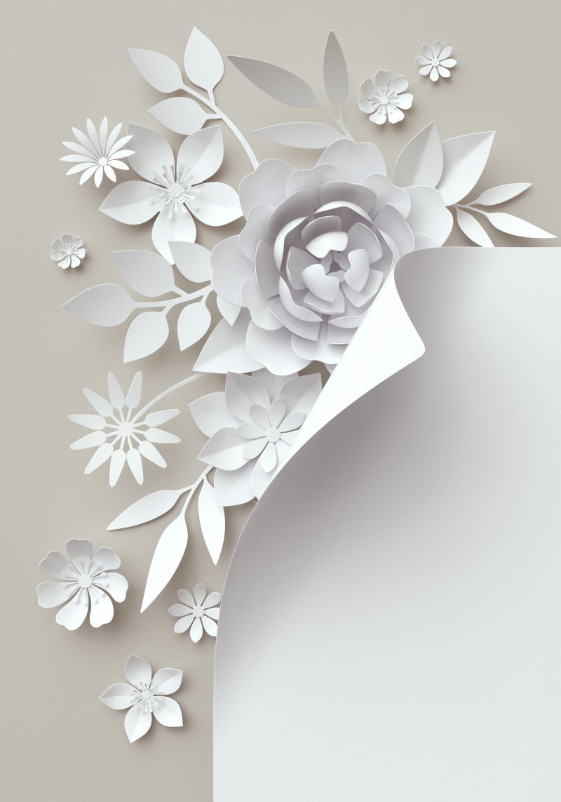 淡灰色背景前的手工纸和手工花朵