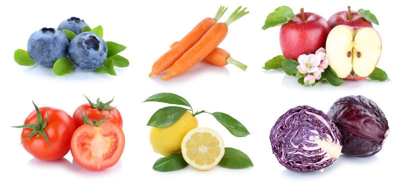 白色背景上的堆好的不同品种的水果蔬菜拼贴