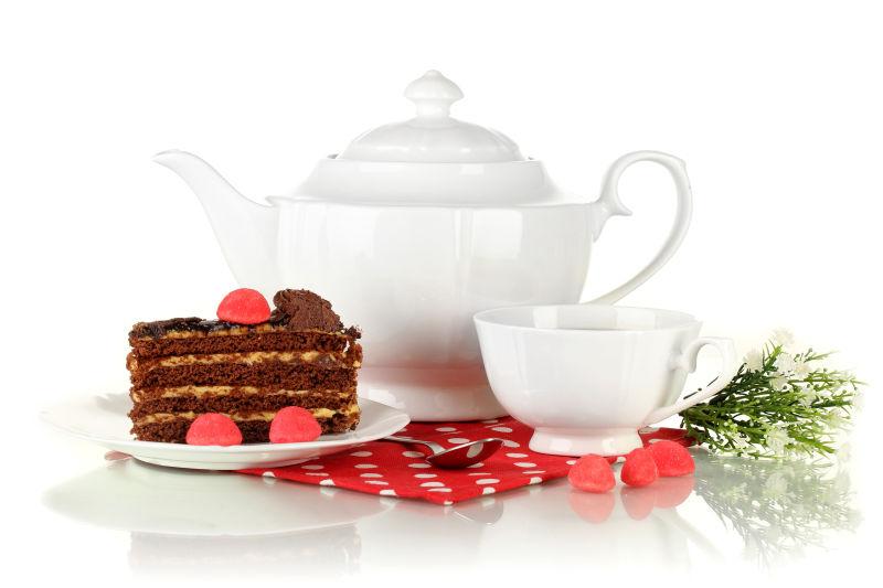 茶壶茶杯和白色蛋糕