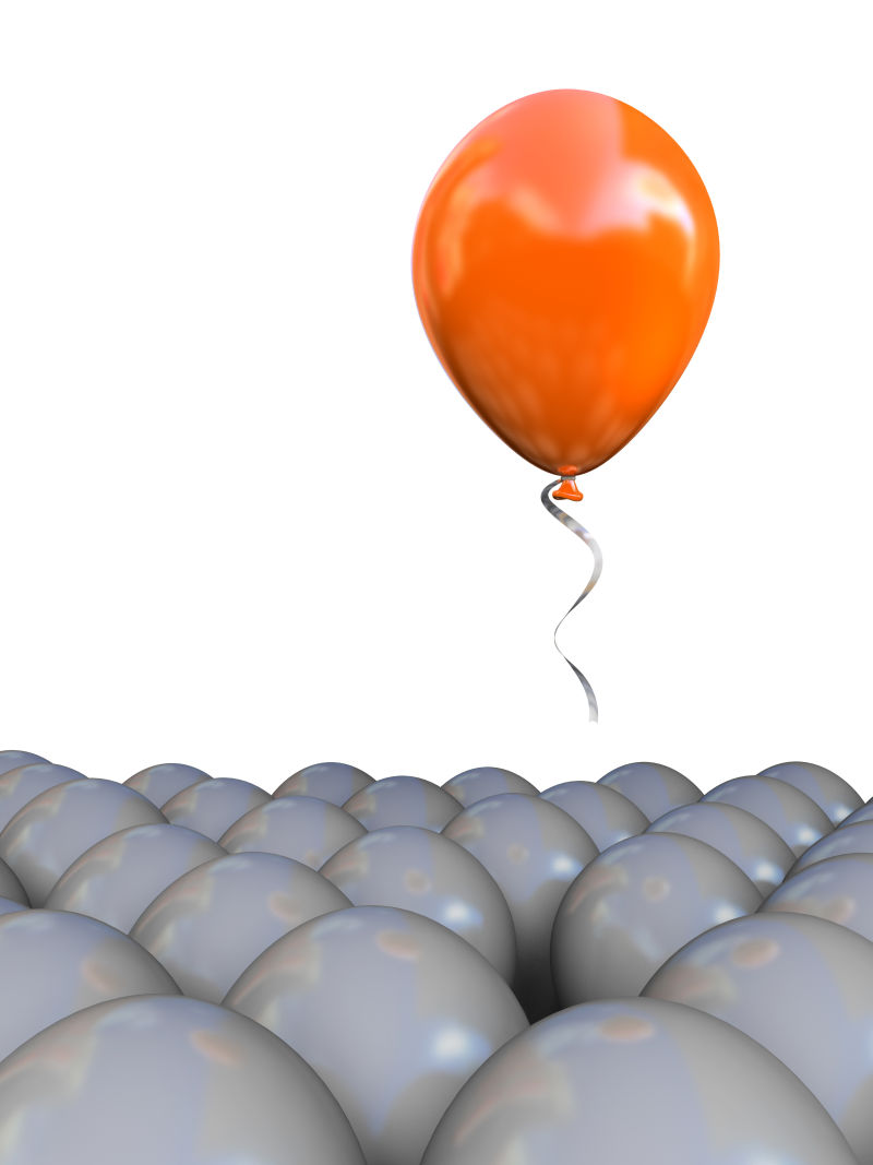 灰气球之间的橙色气球独特概念