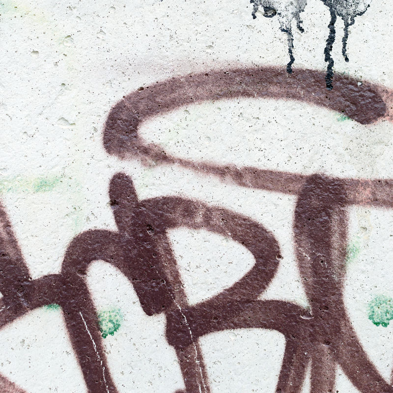 街头艺术-一幅彩色铬红色涂鸦画片段的抽象背景图像