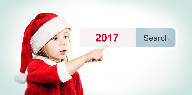 新年概念圣诞帽和虚拟地址栏中的孩子