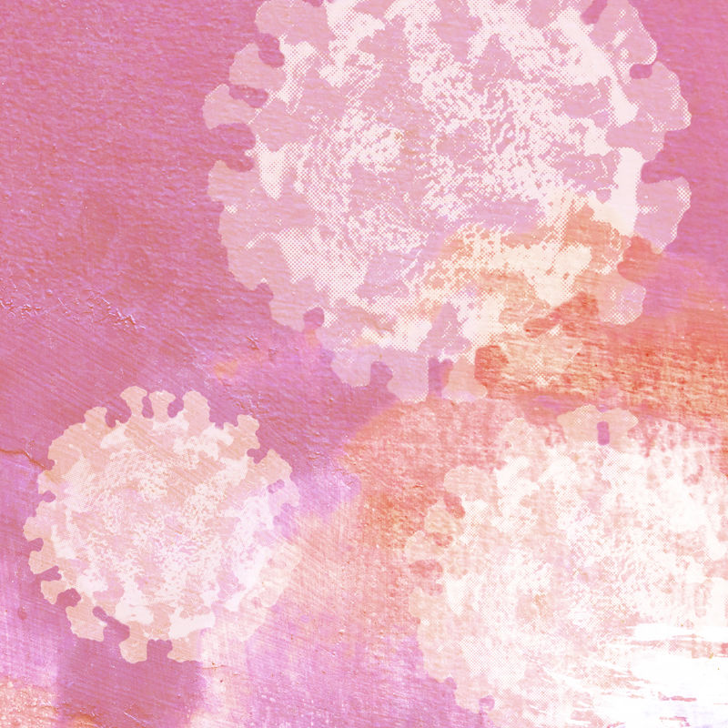 显微镜下粉红色背景上的冠状病毒