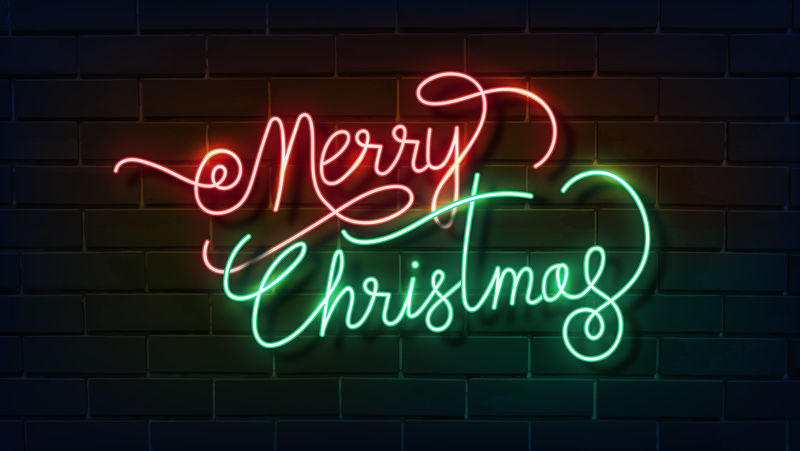 圣诞快乐霓虹灯在一个黑色砖墙矢量