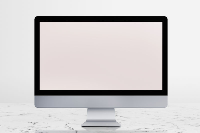 桌面电脑屏幕模型放在白色大理石桌面上