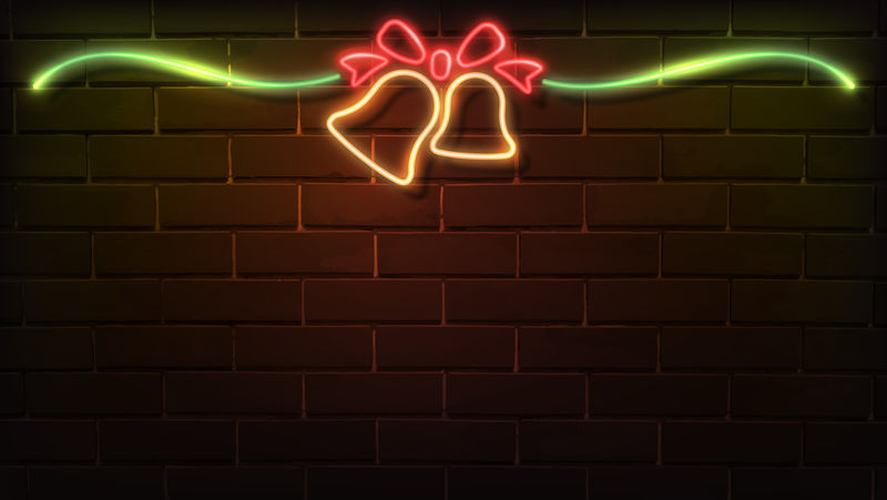 黑色砖墙上的圣诞钟声霓虹灯标牌