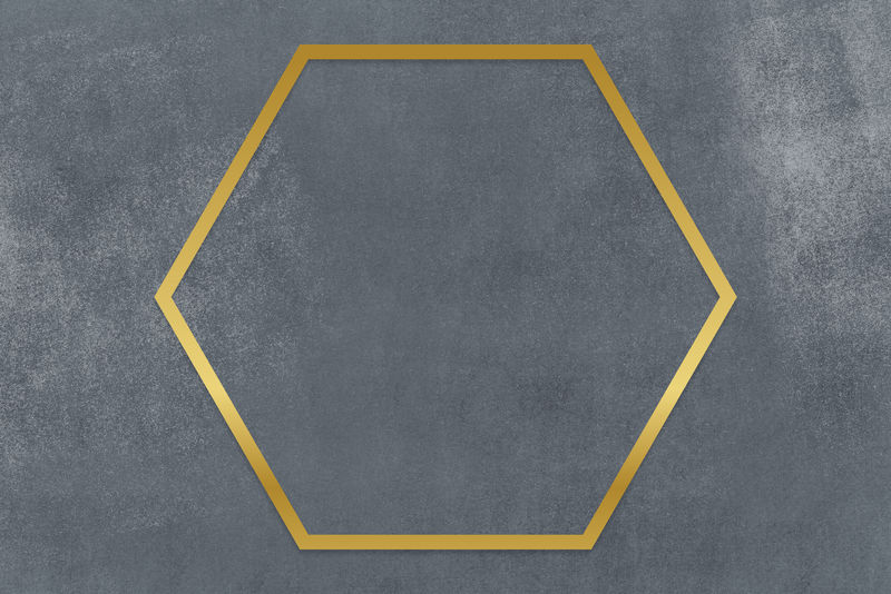 灰色混凝土纹理背景上的金色六边形框架