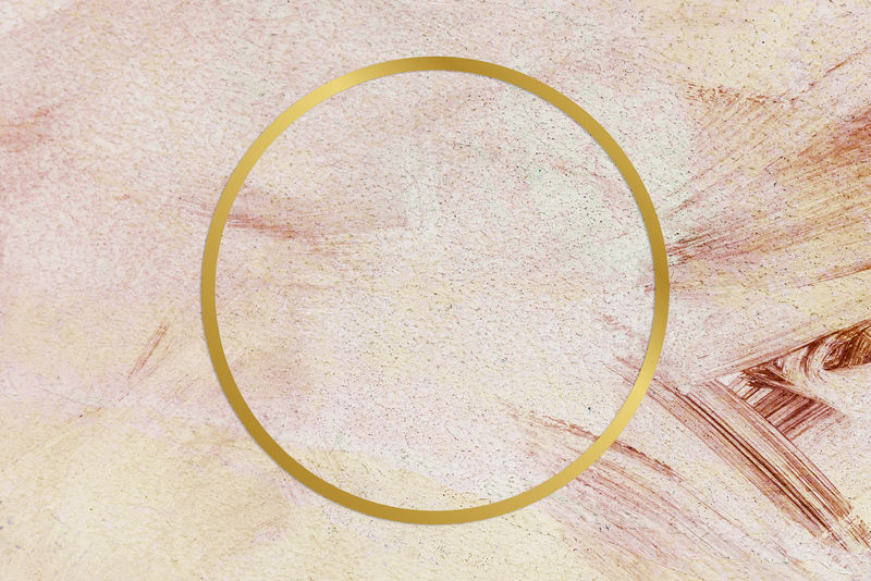 粉色画笔笔划图案背景上的金色圆形框架